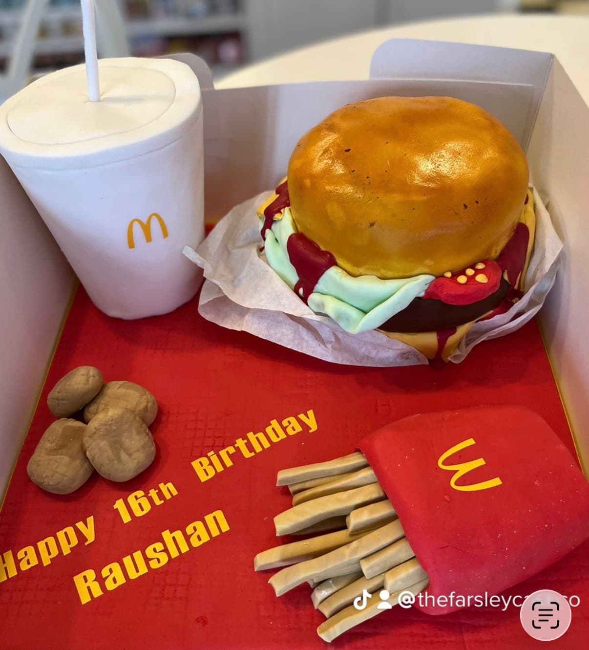 Unique cake shaped like a burger and fries with birthday message
