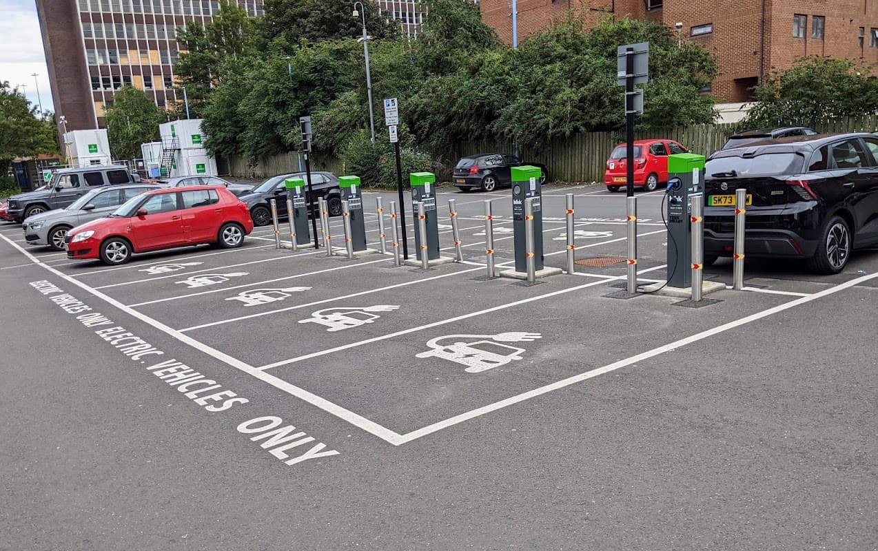 Buxton Street Car Park featuring electric vehicle charging stations and parked cars in a well-maintained area.