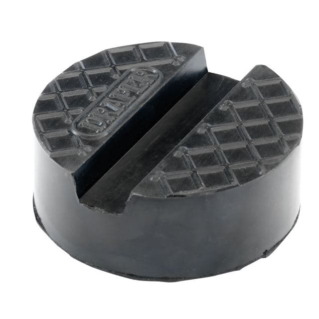 Large round rubber pad for a trolley jack, featuring a textured surface for grip and a central groove, marked with the Draper logo.